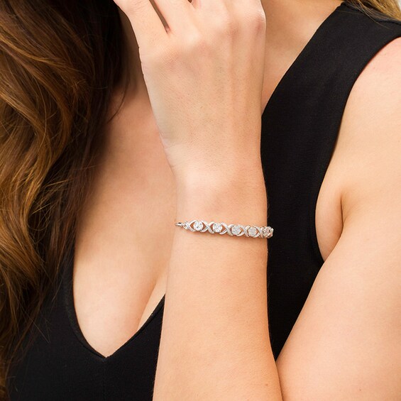 1/10 CT. T.w. Diamond Cascading Infinity with Flowers Bolo Bracelet in Sterling Silver - 9.5"