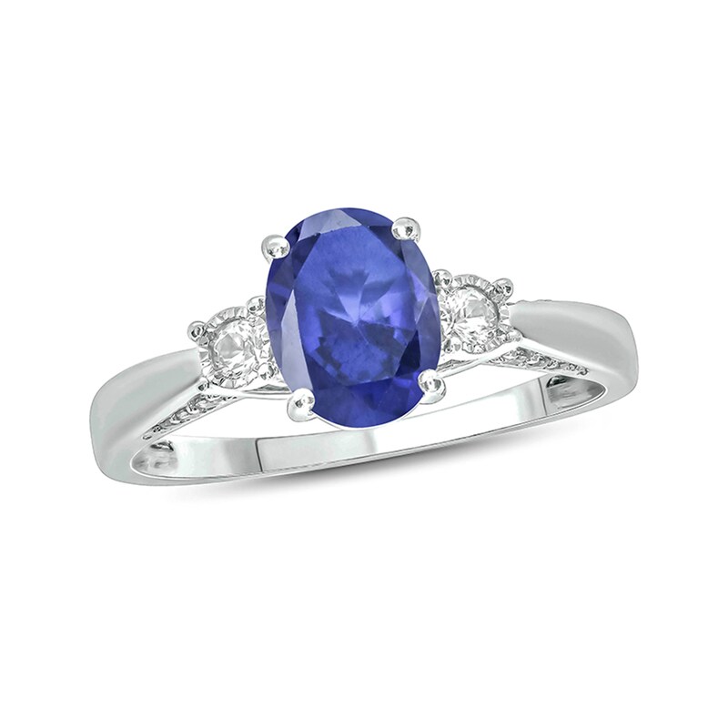 Oval Lab-Created Blue and White Sapphire with 1/15 CT. T.W. Diamond Three Stone Ring in Sterling Silver