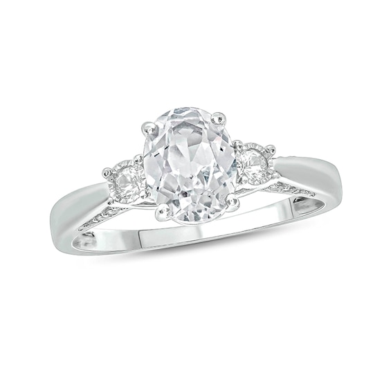 Oval Lab-Created White Sapphire and 1/15 CT. T.w. Diamond Three Stone Ring in Sterling Silver