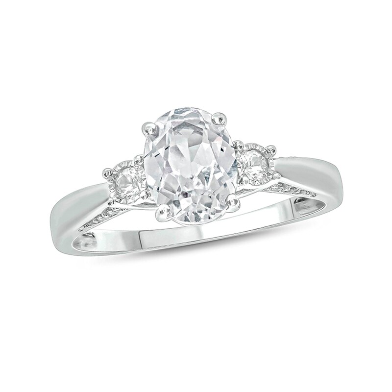 Main Image 1 of Oval Lab-Created White Sapphire and 1/15 CT. T.W. Diamond Three Stone Ring in Sterling Silver