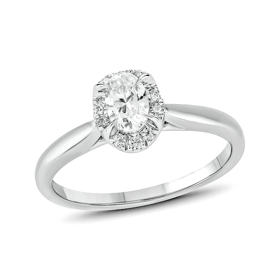 1/2 CT. T.w. Oval Diamond Frame Engagement Ring in 14K White Gold