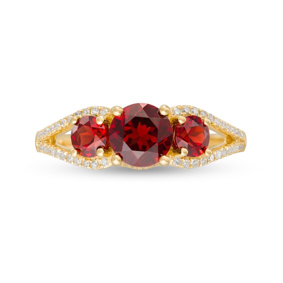 6.0mm Garnet and 1/5 CT. T.w. Diamond Three Stone Split Shank Ring in 10K Gold
