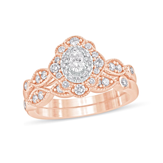 5/8 CT. T.w. Oval Diamond Double Petal Frame Vintage-Style Bridal Set in 10K Rose Gold