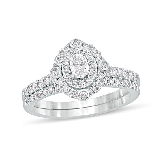 5/8 CT. T.w. Oval Diamond Double Frame Bridal Set in 10K White Gold
