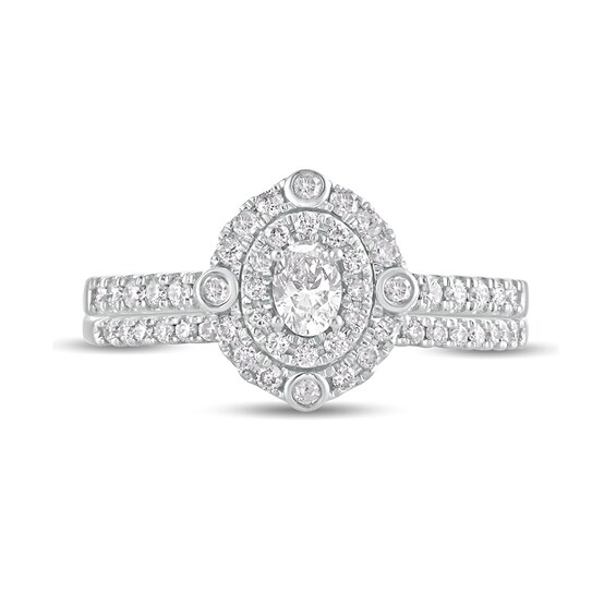 5/8 CT. T.w. Oval Diamond Double Frame Bridal Set in 10K White Gold