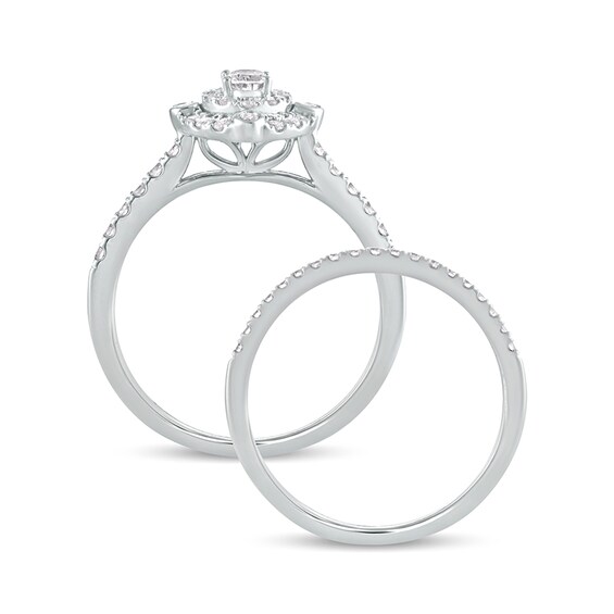 5/8 CT. T.w. Oval Diamond Double Frame Bridal Set in 10K White Gold