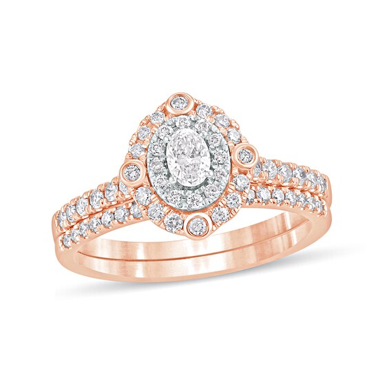 5/8 CT. T.w. Oval Diamond Double Frame Bridal Set in 10K Rose Gold