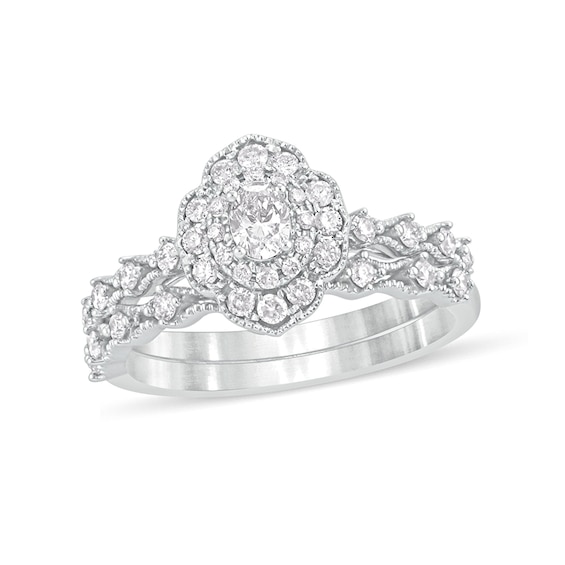 5/8 CT. T.w. Oval Diamond Frame Vintage-Style Bridal Set in 10K White Gold