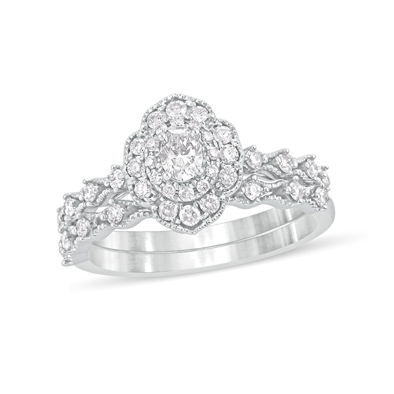 Main Image 1 of 5/8 CT. T.W. Oval Diamond Frame Vintage-Style Bridal Set in 10K White Gold
