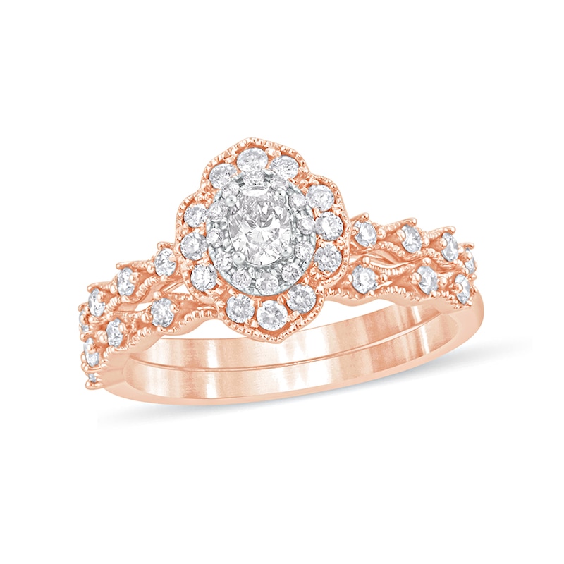 5/8 CT. T.W. Oval Diamond Frame Vintage-Style Bridal Set in 10K Rose Gold