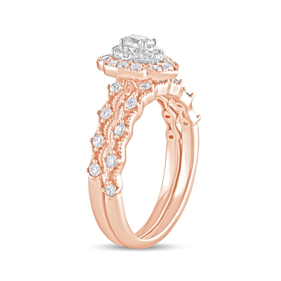 5/8 CT. T.w. Oval Diamond Frame Vintage-Style Bridal Set in 10K Rose Gold