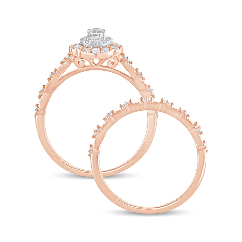 5/8 CT. T.W. Oval Diamond Frame Vintage-Style Bridal Set in 10K Rose Gold