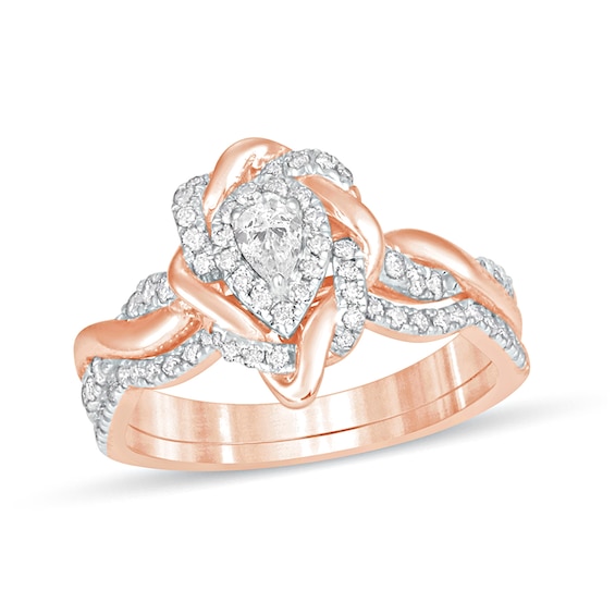 5/8 CT. T.w. Pear-Shaped Diamond Frame Twist Shank Bridal Set in 10K Rose Gold