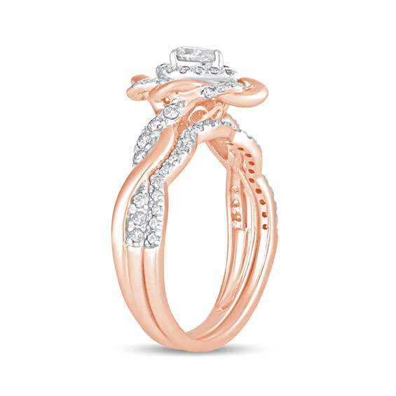 5/8 CT. T.w. Pear-Shaped Diamond Frame Twist Shank Bridal Set in 10K Rose Gold