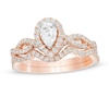 1 CT. T.W. Pear-Shaped Diamond Frame Twist Split Shank Bridal Set in 14K Rose Gold