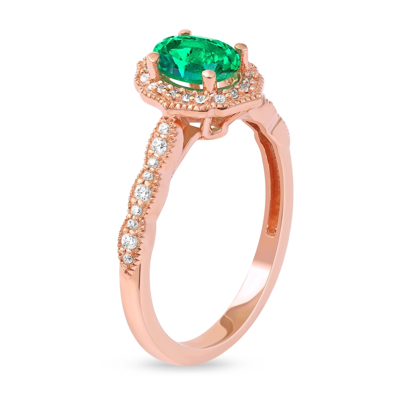 Oval Emerald and 1/6 CT. T.W. Diamond Quatrefoil Frame Vintage-Style Ring in 10K Rose Gold