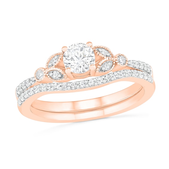 4.5mm Lab-Created White Sapphire and 1/5 CT. T.w. Diamond Bridal Set in Sterling Silver with 14K Rose Gold Plate