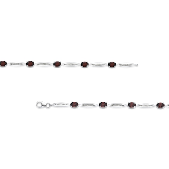 Oval Garnet and 1/6 CT. T.w. Diamond Link Bracelet in Sterling Silver - 7.25"