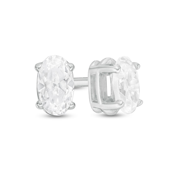 1/2 CT. T.w. Certified Oval Diamond Solitaire Stud Earrings in 14K White Gold (I/I2)