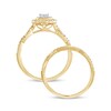 1/2 CT. T.W. Princess-Cut Quad Diamond Frame Twist Shank Bridal Set in 10K Gold