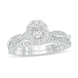 1/2 CT. T.W. Oval Diamond Frame Twist Shank Bridal Set in 10K White Gold