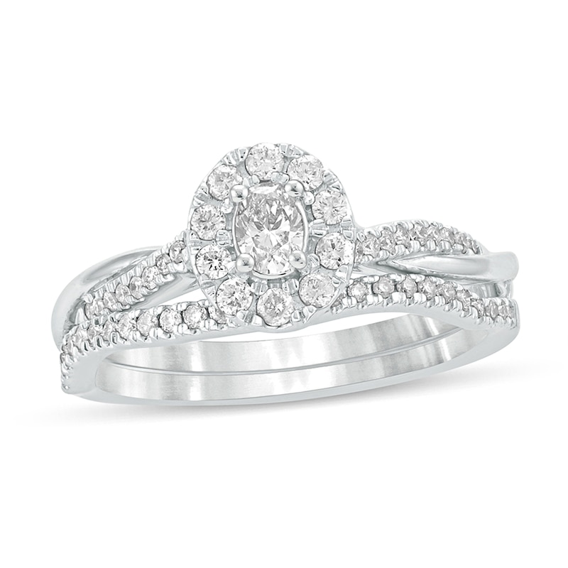 Main Image 1 of 1/2 CT. T.W. Oval Diamond Frame Twist Shank Bridal Set in 10K White Gold