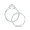 1/2 CT. T.W. Oval Diamond Frame Twist Shank Bridal Set in 10K White Gold