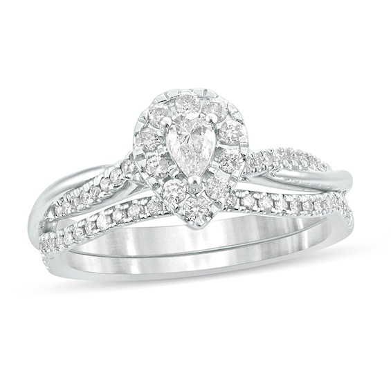 1/2 CT. T.w. Pear-Shaped Diamond Frame Twist Shank Bridal Set in 10K White Gold