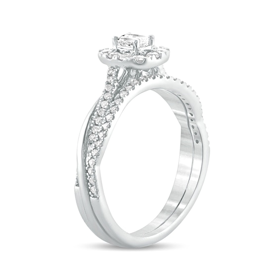 1/2 CT. T.w. Emerald-Cut Diamond Frame Twist Shank Bridal Set in 10K White Gold