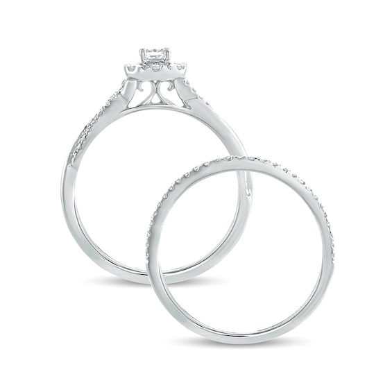 1/2 CT. T.w. Emerald-Cut Diamond Frame Twist Shank Bridal Set in 10K White Gold