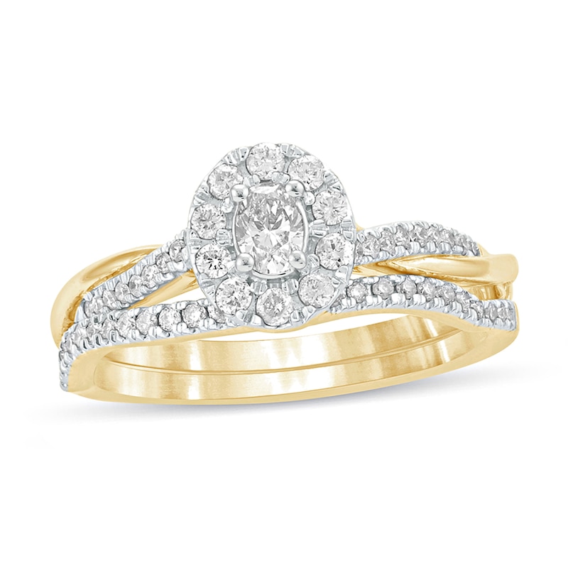 Main Image 1 of 1/2 CT. T.W. Oval Diamond Frame Twist Shank Bridal Set in 10K Gold