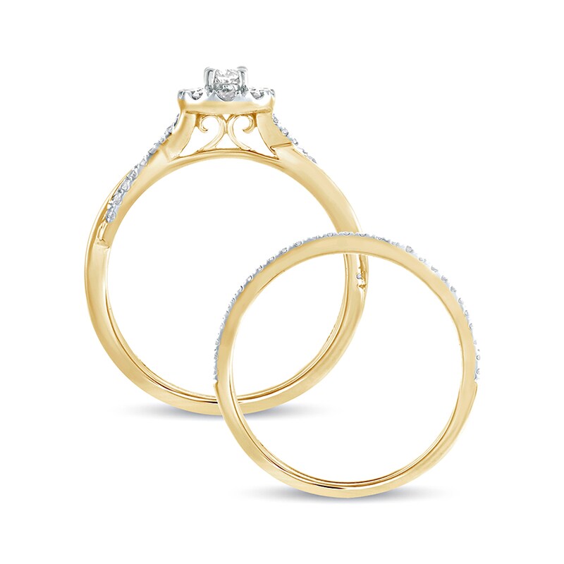 1/2 CT. T.W. Oval Diamond Frame Twist Shank Bridal Set in 10K Gold | Zales