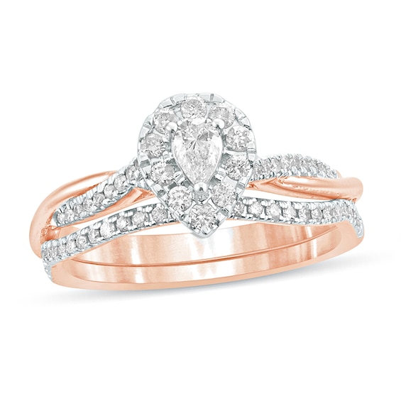 1/2 CT. T.w. Pear-Shaped Diamond Frame Twist Shank Bridal Set in 10K Rose Gold
