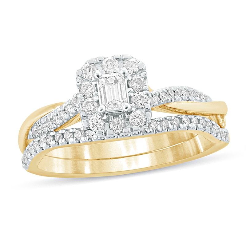 Main Image 1 of 1/2 CT. T.W. Emerald-Cut Diamond Frame Twist Shank Bridal Set in 10K Gold