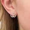 Thumbnail Image 2 of 1/8 CT. T.W. Diamond Interlocking Circles Stud Earrings in Sterling Silver