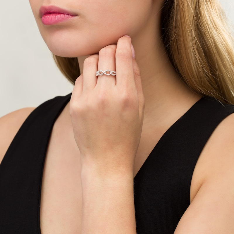 Main Image 2 of 1/8 CT. T.W. Diamond Sideways Infinity Angel Wings Ring in Sterling Silver