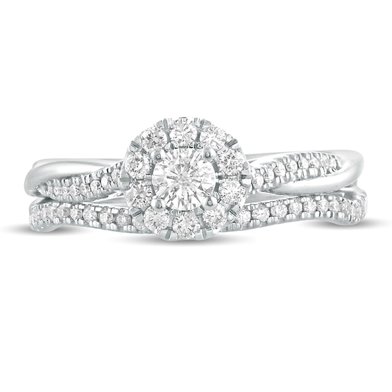 1/2 CT. T.w. Diamond Frame Twist Shank Bridal Set in 10K White Gold