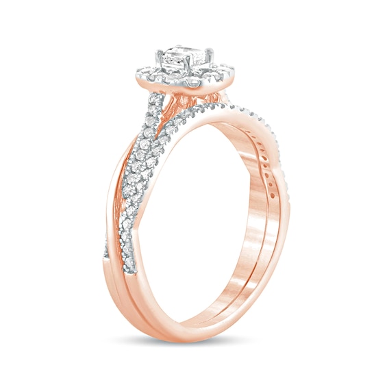 1/2 CT. T.w. Emerald-Cut Diamond Frame Twist Shank Bridal Set in 10K Rose Gold