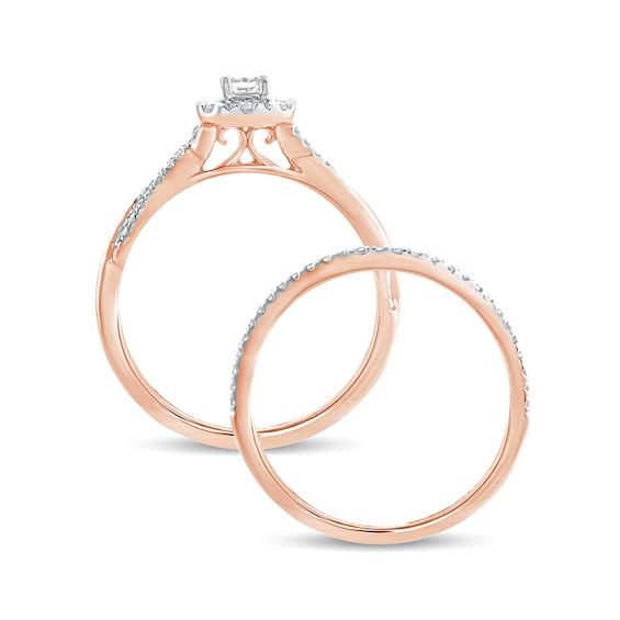 1/2 CT. T.w. Emerald-Cut Diamond Frame Twist Shank Bridal Set in 10K Rose Gold