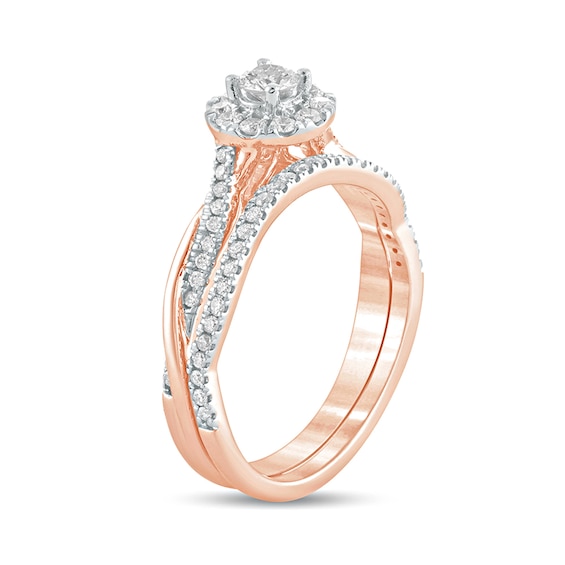 1/2 CT. T.w. Diamond Frame Twist Shank Bridal Set in 10K Rose Gold