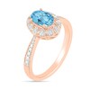 Oval Blue Topaz and 1/20 CT. T.W. Diamond Frame Tapered Shank Vintage-Style Ring in 10K Rose Gold