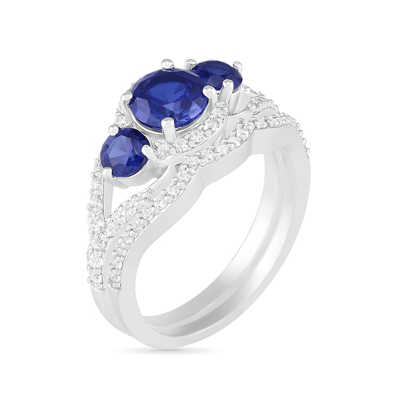 Lab-Created Blue and White Sapphire Frame Three Stone Split Shank Bridal Set in Sterling Silver