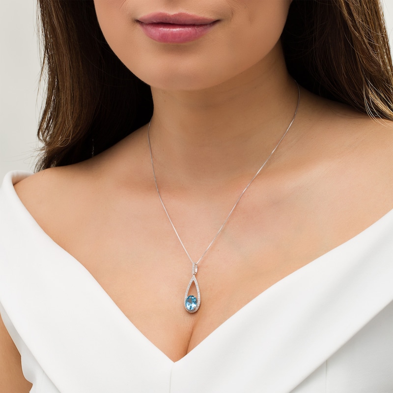 Main Image 3 of Marilyn Monroe™ Collection Oval Swiss Blue Topaz and 1/5 CT. T.W. Diamond Frame Teardrop Pendant in Sterling Silver