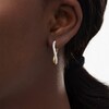 Thumbnail Image 2 of 1/2 CT. T.W. Diamond Wavy Hoop Earrings in 10K Gold