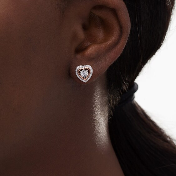 1/6 CT. T.w. Diamond Heart Stud Earrings in Sterling Silver and 10K Rose Gold
