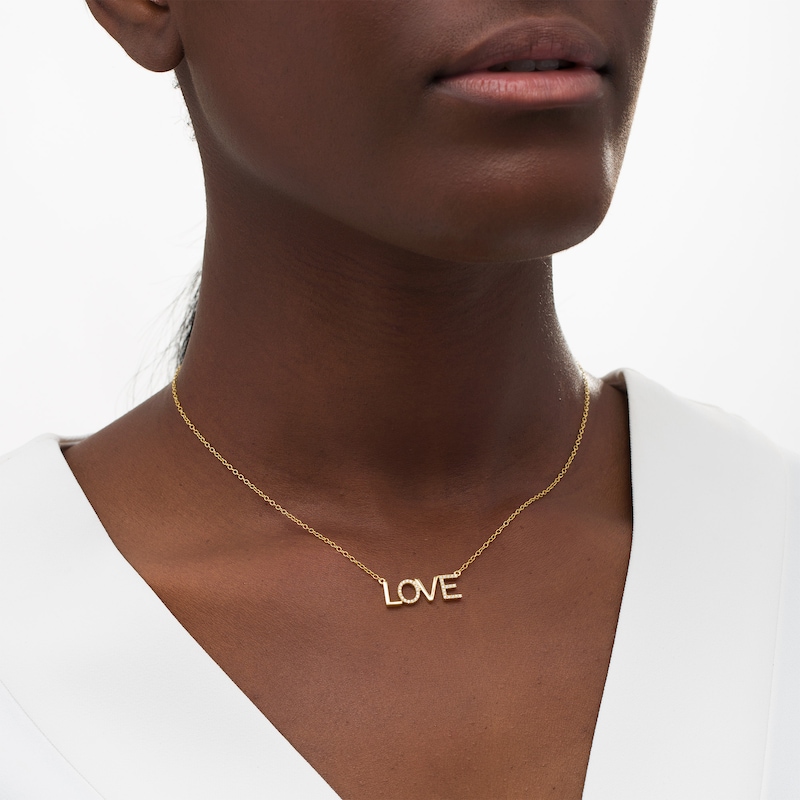 Main Image 2 of 1/8 CT. T.W. Diamond "LOVE" Necklace in 10K Gold