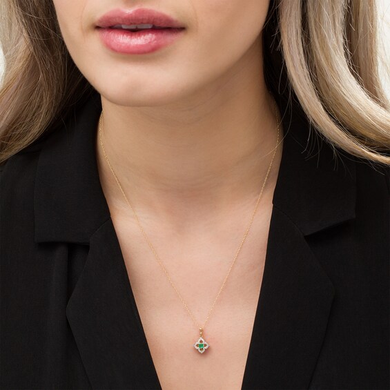 3.0mm Emerald and 1/10 CT. T.w. Diamond Open Petal Frame Drop Pendant in 10K Gold