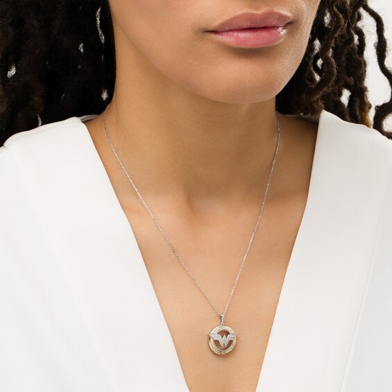 Wonder Womanâ¢ Collection 1/10 CT. T.w. Diamond Symbol Circle Pendant in Sterling Silver and 10K Gold