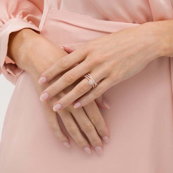 1 CT. T.W. Oval Diamond Frame Crossover Bridal Set in 14K Rose Gold 1 CT. T.W. Oval Diamond Frame Crossover Bridal Set in 14K Rose Gold