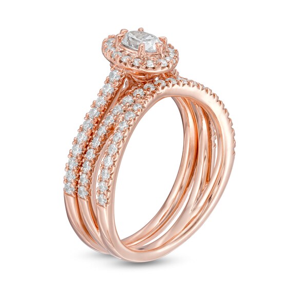 1 CT. T.W. Oval Diamond Frame Crossover Bridal Set in 14K Rose Gold 1 CT. T.W. Oval Diamond Frame Crossover Bridal Set in 14K Rose Gold